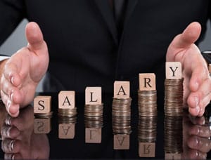 Hands protecting stacked coins labeled 'SALARY
